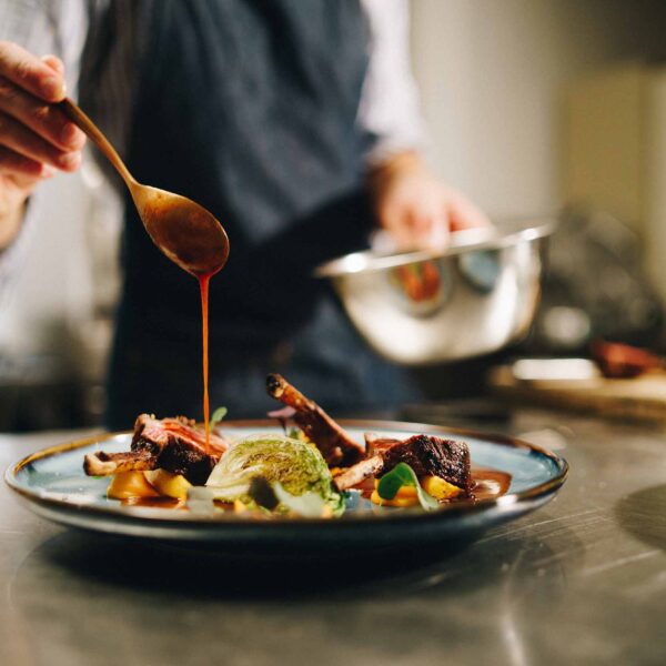 chef-plates-exquisite-dish-in-restaurant-kitchen-2026-01-07-07-22-07-utc
